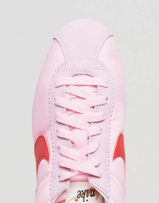 Nike classic cortez pink and store white trainers