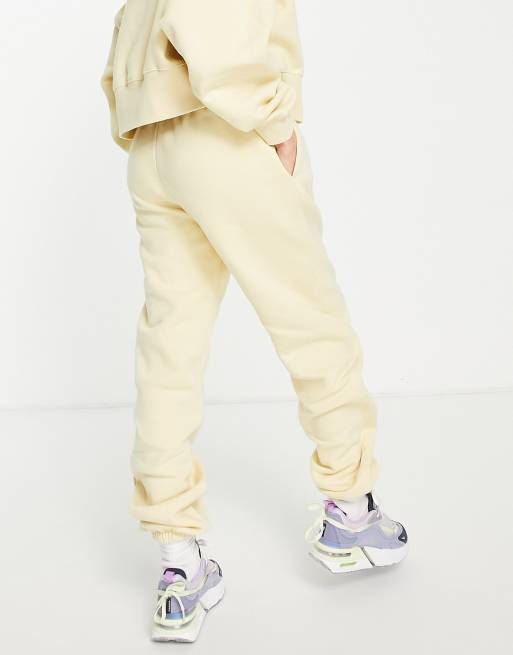 Nike clear the mind mini swoosh joggers in lemon yellow