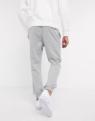 nike club casual fit cuffed joggers in grey