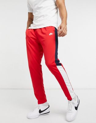 white and red nike joggers