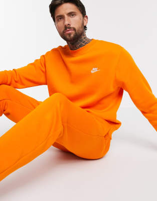 Nike Club crew neck sweat in orange | ASOS