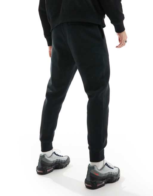 Nike Club cuffed joggers in black ASOS