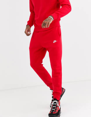 red nike trackies