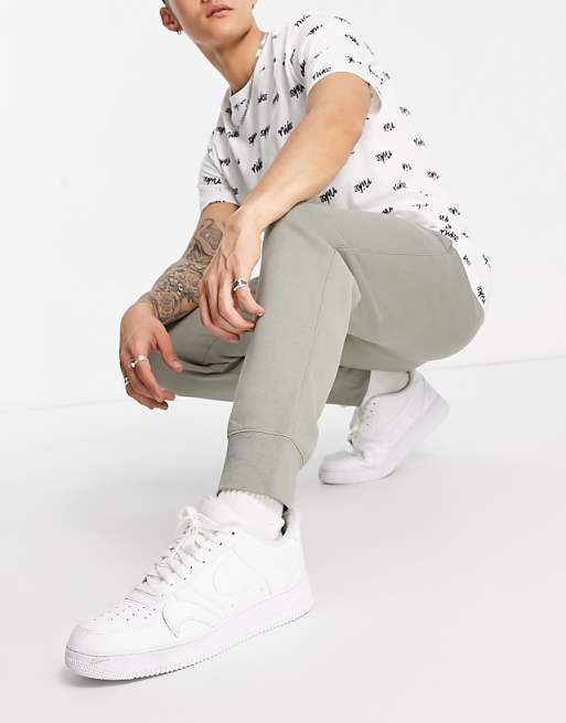 Nike Club cuffed sweatpants in dusty khaki | ASOS