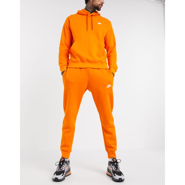 orange sweatsuit nike