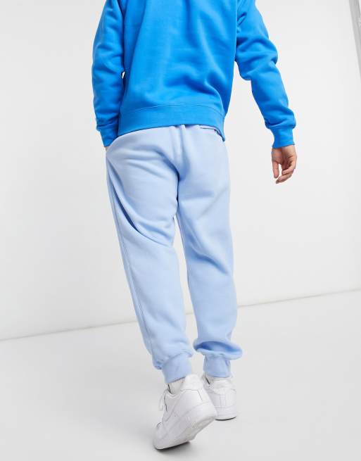 Nike Club cuffed sweatpants in pale blue ASOS