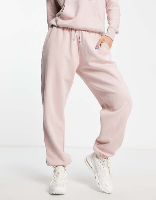 Nike Club essential slim mid-rise jogger in pink