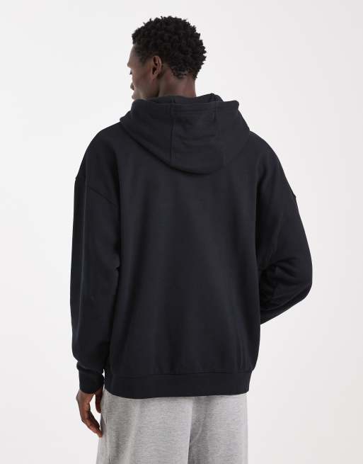 Nike Club Felpa oversize in spugna nera con cappuccio ASOS
