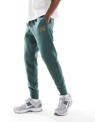 Nike Club festive joggers in dark green