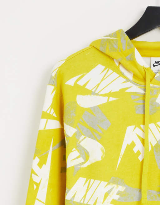 Nike Club Fleece all over logo print hoodie in yellow