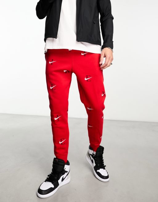 Red and store white nike joggers