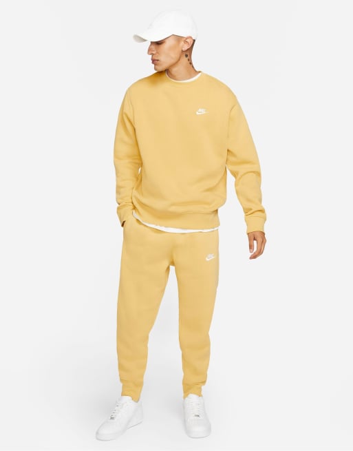 Nike Club Fleece cuffed sweatpants in dusty yellow ASOS