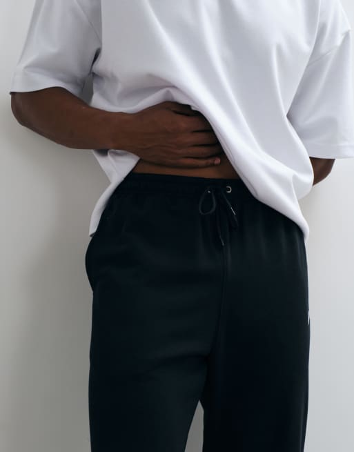 Nike Club French Terry cuffed joggers in black, 5 of 5