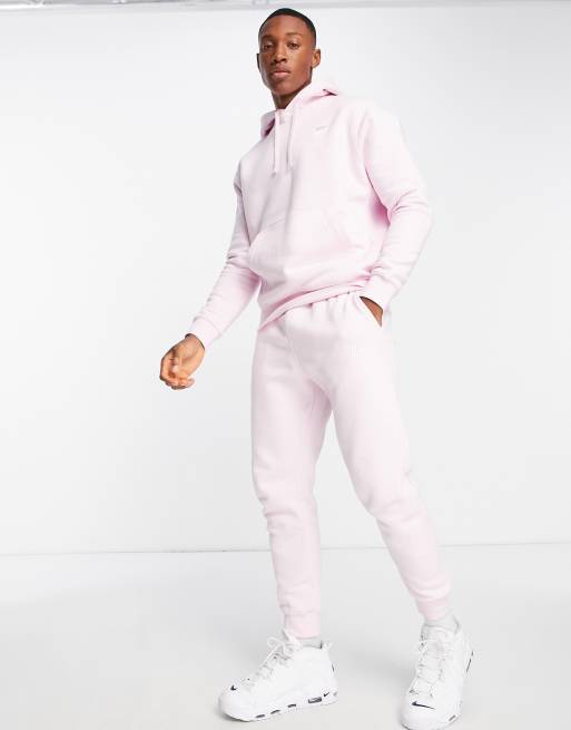 Nike pink store tracksuit mens