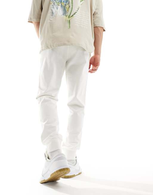 Nike Club logo knit sweatpants in off white