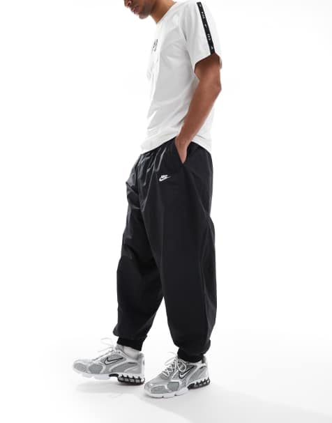 Nike Club oversized tracksuit bottoms in black - view 1