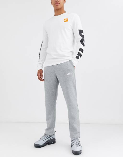 Nike - Jogger en polaire à logo virgule - Gris