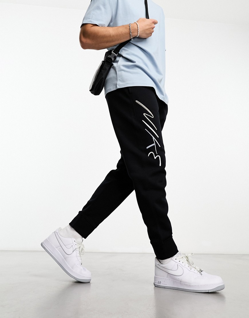 Nike Club + slogan sweatpants in black