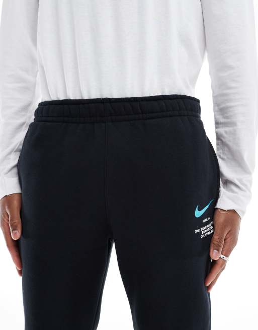 Nike Club Swoosh graphic joggers in black and blue | ASOS