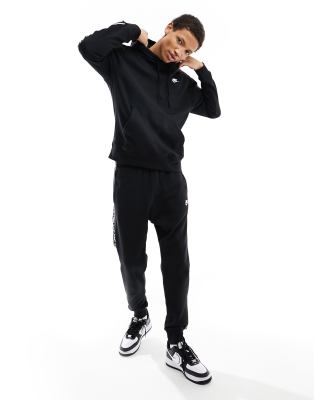 Nike Nike Club Tape tracksuit in black