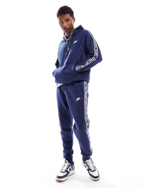 Nike poly taped on sale tracksuit