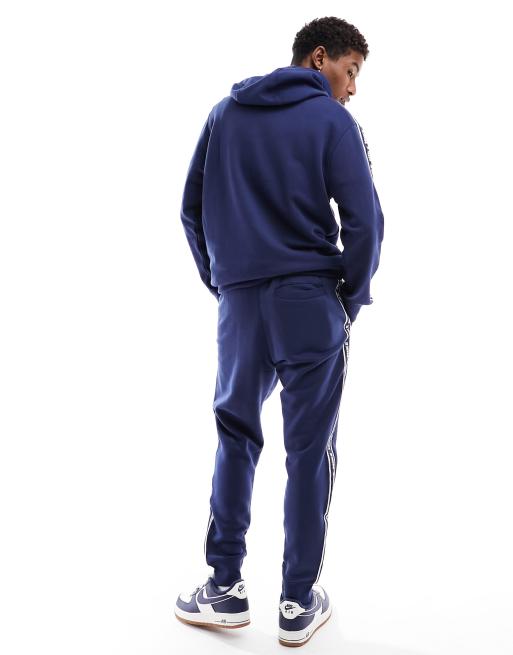 Nike taped tracksuit outlet blue