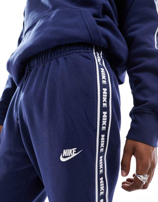 Nike tracksuit 2024 navy blue