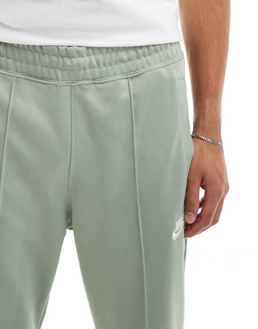 Nike green track pants sale