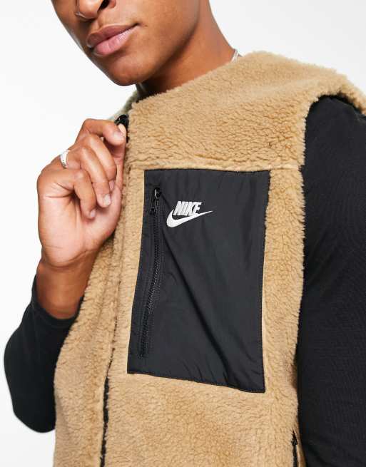 Nike Club Winter reversible gilet in dark driftwood black ASOS