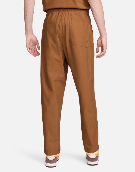 Nike FC Barcelona トレーニングパンツ ブラウン Nike Club woven Barcelona pants in brown | ASOS