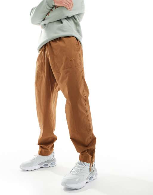 Brown nike pants online