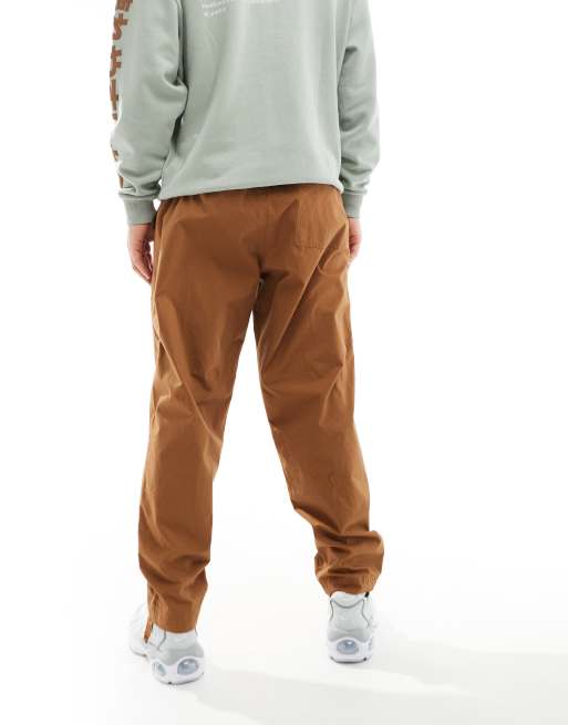 Nike Club woven Barcelona trousers in brown | ASOS