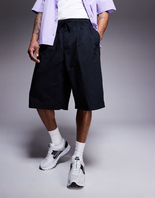 Nike Club Woven oversized shorts in black