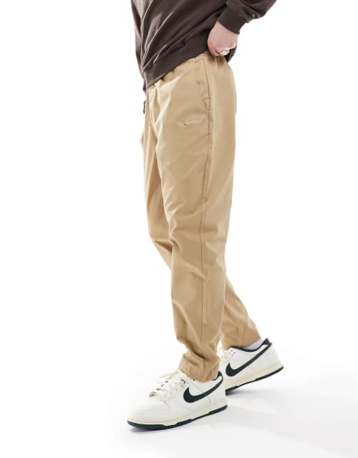 Nike Club woven tapered pants in beige | ASOS