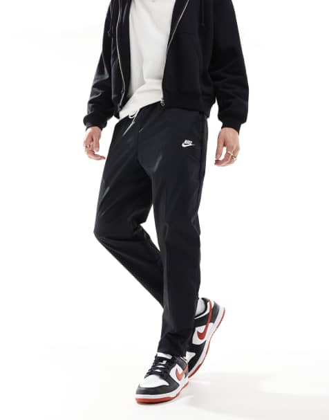 Nike Club woven tapered pants in black - view 1