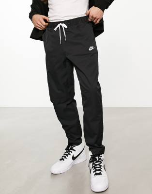 Nike Club Men's Woven Tapered-Leg Trousers. Nike LU