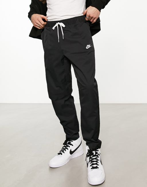 Nike Club Men's Woven Tapered Leg Pants.