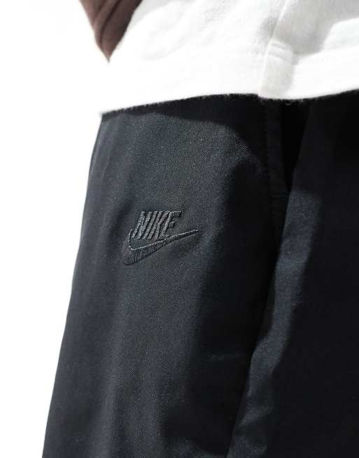 Nike Club woven tapered trousers in black 