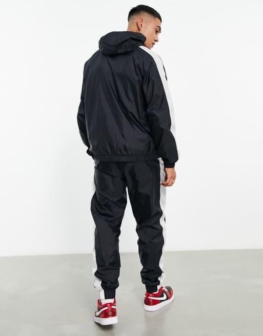 Black nike tracksuit store white stripe