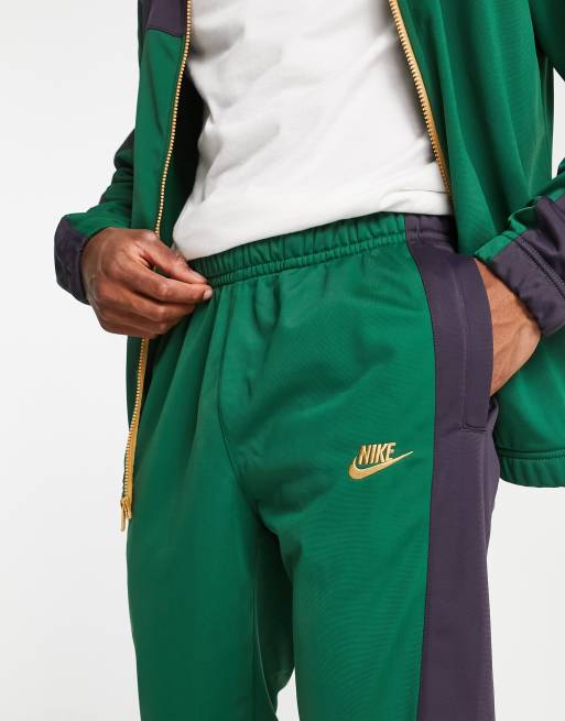 Nike woven hot sale tracksuit green