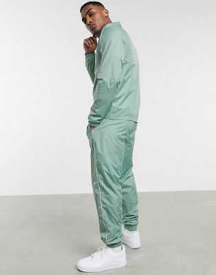 nike woven tracksuit set in green