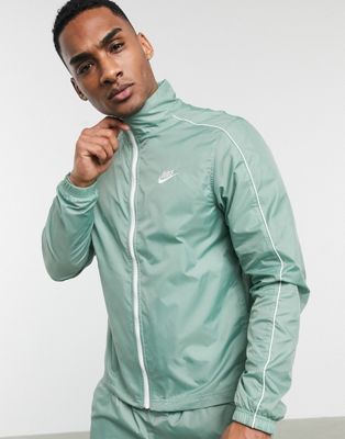 nike woven tracksuit green