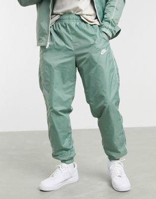 Nike Club woven tracksuit set in dusty 