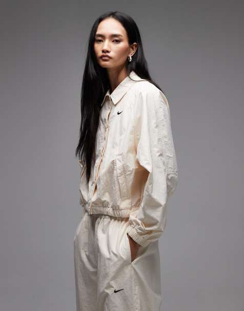Nike coach jacket in cream