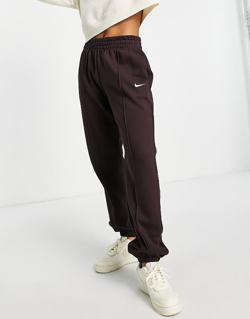 Nike Collection Fleece loose-fit cuffed sweatpants in dark brown ...