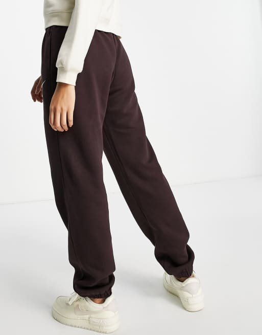 Nike Collection Fleece loose-fit cuffed sweatpants in dark brown - BROWN