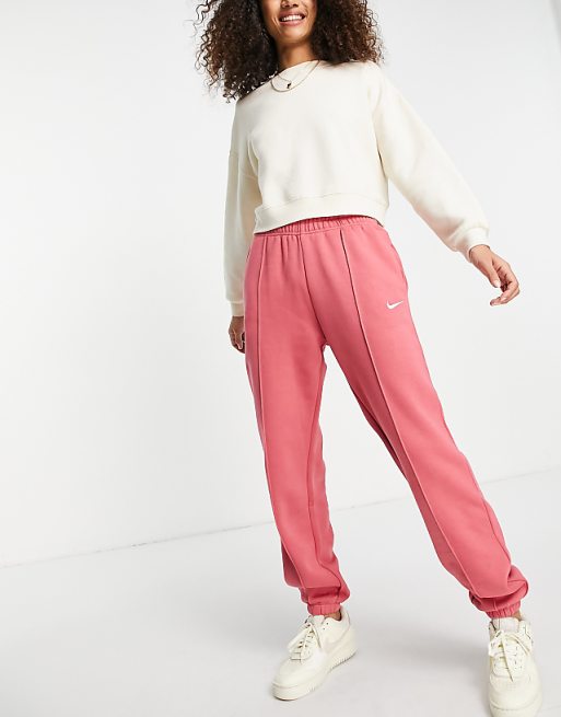Nike Collection Fleece loose-fit cuffed sweatpants in dusty red | ASOS