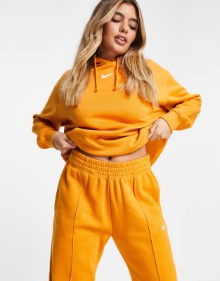 nike mini swoosh oversized yellow joggers