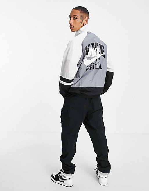 Nike Collegiate vintage back print track jacket in black and grey
