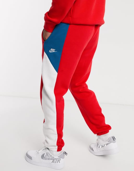 Nike color block cuffed sweatpants in red ASOS